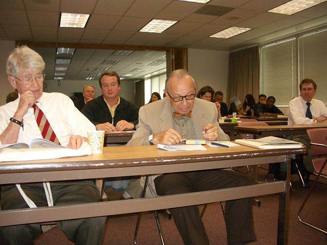 Buzanski and Norton photograph in a Senate meeting.