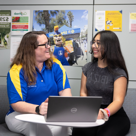 student being helped by staff member at sjsu cares